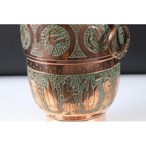 183 - Copper Lidded Urn with engraved Persian / Zoroastrian type decoration, two ringed handled, 35cm high