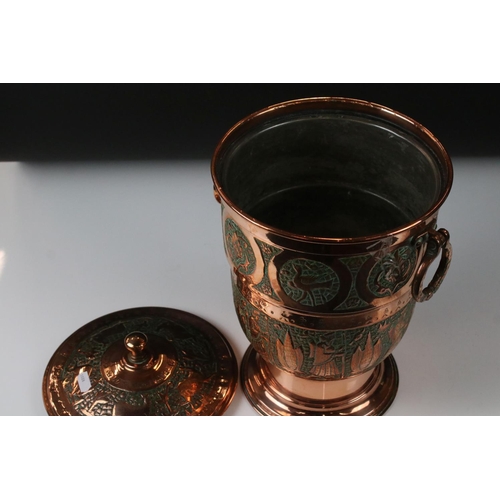 183 - Copper Lidded Urn with engraved Persian / Zoroastrian type decoration, two ringed handled, 35cm high