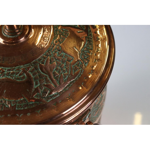 183 - Copper Lidded Urn with engraved Persian / Zoroastrian type decoration, two ringed handled, 35cm high