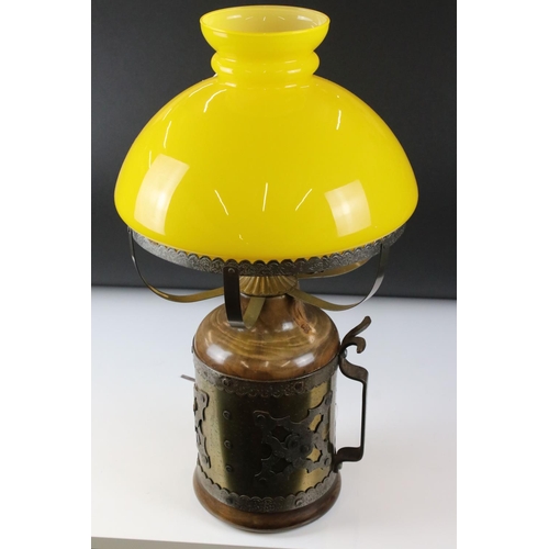 185 - Table Lamp, the metal wood effect base covered with a brass and white metal band, holding yellow gla... 