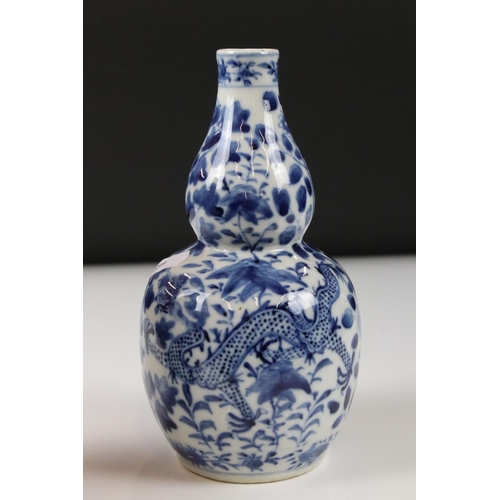 23 - Pair of Chinese porcelain Blue and White Double Gourd Vases decorated with dragons amongst foliage, ... 