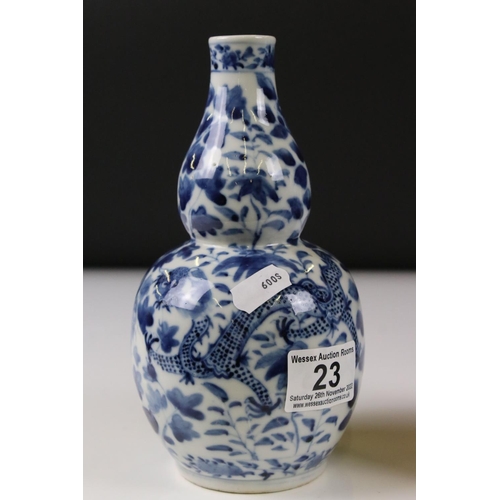 23 - Pair of Chinese porcelain Blue and White Double Gourd Vases decorated with dragons amongst foliage, ... 