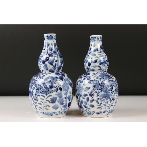 23 - Pair of Chinese porcelain Blue and White Double Gourd Vases decorated with dragons amongst foliage, ... 