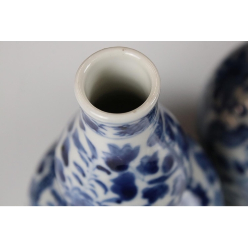 23 - Pair of Chinese porcelain Blue and White Double Gourd Vases decorated with dragons amongst foliage, ... 