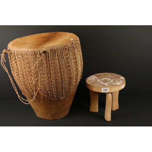 439 - African cowhide bongo drum with twine fastenings, 47cm high, together with a small African beadwork ... 