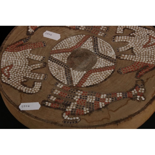 439 - African cowhide bongo drum with twine fastenings, 47cm high, together with a small African beadwork ... 