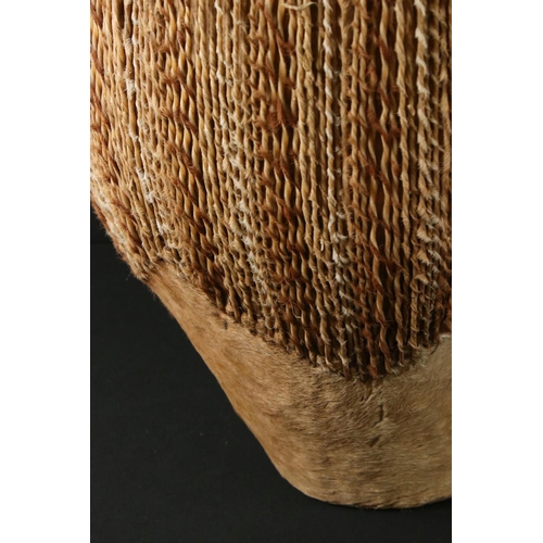 439 - African cowhide bongo drum with twine fastenings, 47cm high, together with a small African beadwork ... 