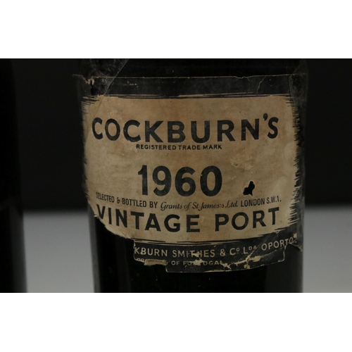 445 - Two bottles of vintage port to include Cockburns 1960 and Warre's 1975 examples.