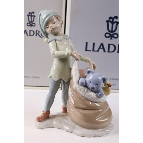 48 - Two Lladro Figures including ' A Christmas Duet ' model 06714 and ' Sack of Dreams ' model 6894, bot... 