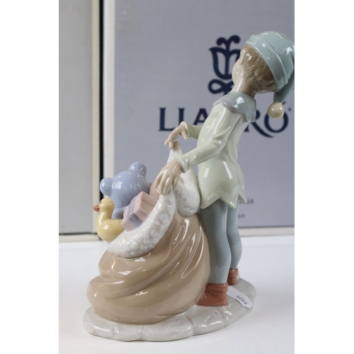 48 - Two Lladro Figures including ' A Christmas Duet ' model 06714 and ' Sack of Dreams ' model 6894, bot... 