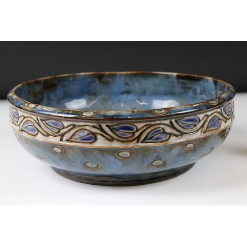 74 - Royal Doulton Stoneware Bowl decorated with an incised leaf pattern on a blue ground, 26cm diameter,... 