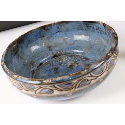 74 - Royal Doulton Stoneware Bowl decorated with an incised leaf pattern on a blue ground, 26cm diameter,... 