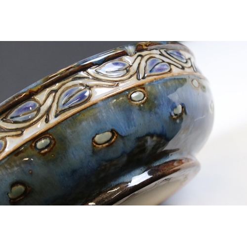 74 - Royal Doulton Stoneware Bowl decorated with an incised leaf pattern on a blue ground, 26cm diameter,... 