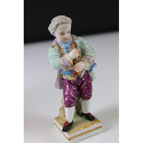 8 - Continental Porcelain Figure of a Boy playing a Musical Instrument, Meissen style blue cross swords ... 