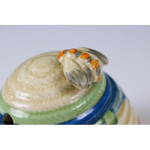 84 - Clarice Cliff Fantasque Bizarre Beehive Honey Pot decorated in the Blue Autumn pattern, 10cm high