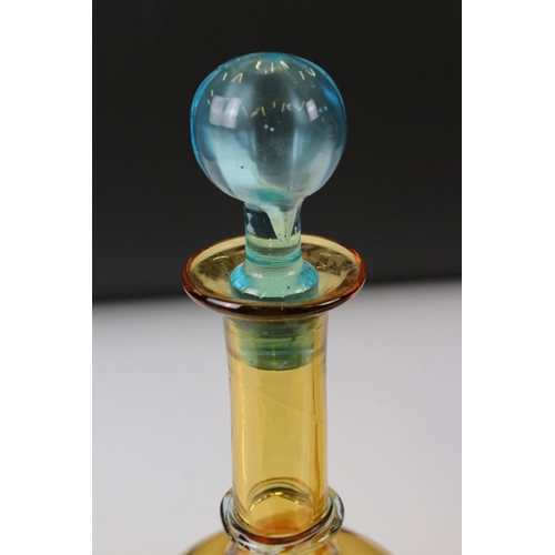 85 - Pair of Early 20th century Amber Glass Decanters with Blue Glass Stoppers, 27cm high