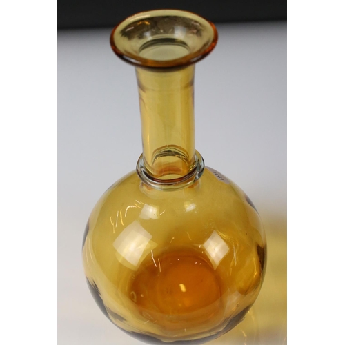 85 - Pair of Early 20th century Amber Glass Decanters with Blue Glass Stoppers, 27cm high