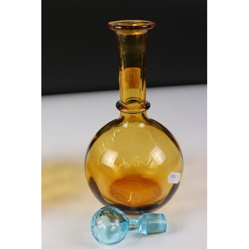 85 - Pair of Early 20th century Amber Glass Decanters with Blue Glass Stoppers, 27cm high