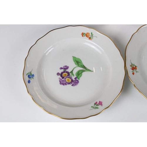 87 - Set of Four Meissen Porcelain Plates, each with a different hand painted floral design and gilt edge... 