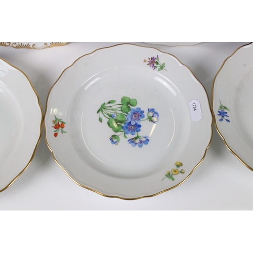 87 - Set of Four Meissen Porcelain Plates, each with a different hand painted floral design and gilt edge... 