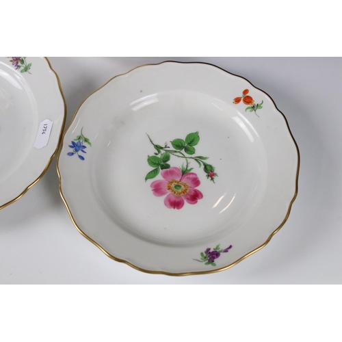 87 - Set of Four Meissen Porcelain Plates, each with a different hand painted floral design and gilt edge... 