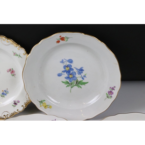 87 - Set of Four Meissen Porcelain Plates, each with a different hand painted floral design and gilt edge... 