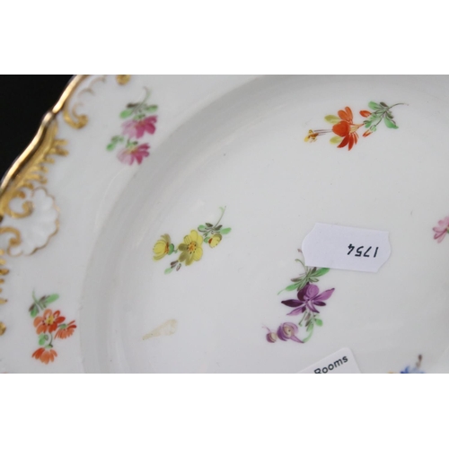 87 - Set of Four Meissen Porcelain Plates, each with a different hand painted floral design and gilt edge... 