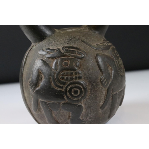 88 - Replica Peruvian Moche Pottery Stirrup Drinking Vessel with moulded decoration of dancing figures, 2... 