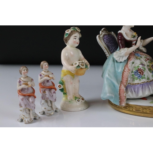 94 - Chelsea style Porcelain Figure Group of a Couple playing draughts, gold anchor mark to base, 16cm hi... 