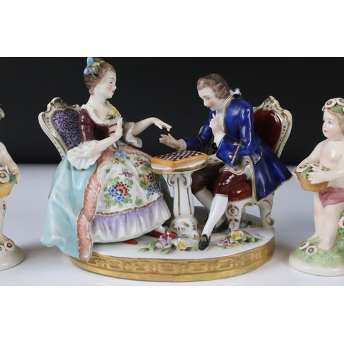 94 - Chelsea style Porcelain Figure Group of a Couple playing draughts, gold anchor mark to base, 16cm hi... 