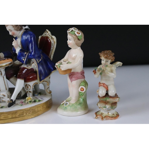 94 - Chelsea style Porcelain Figure Group of a Couple playing draughts, gold anchor mark to base, 16cm hi... 