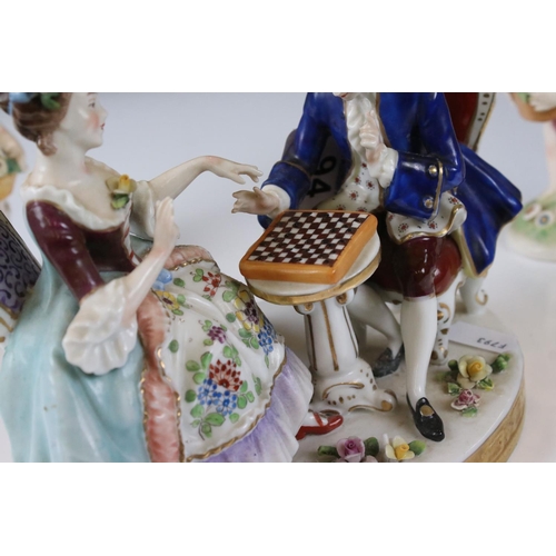 94 - Chelsea style Porcelain Figure Group of a Couple playing draughts, gold anchor mark to base, 16cm hi... 