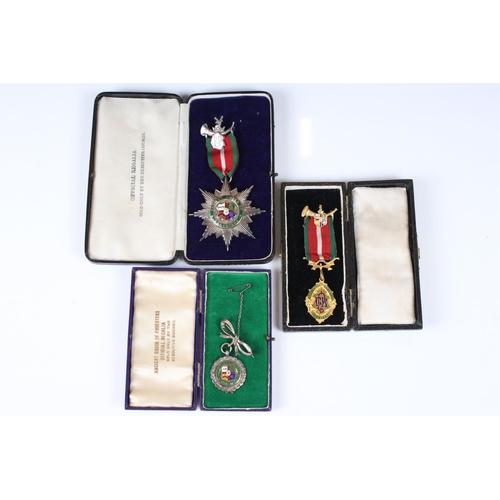 189 - A collection of three cased Ancient Order of Foresters medals / jewels to include two silver example... 