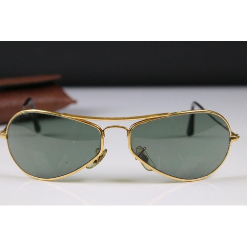 192 - A pair of vintage aviator style sunglasses complete with case.