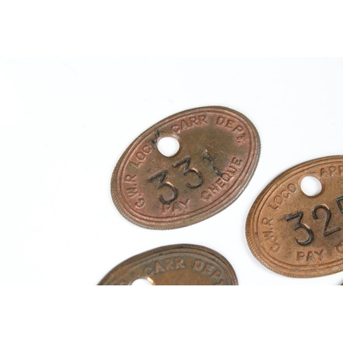 193 - A collection of five GWR / Great Western Railways pay cheque tokens.