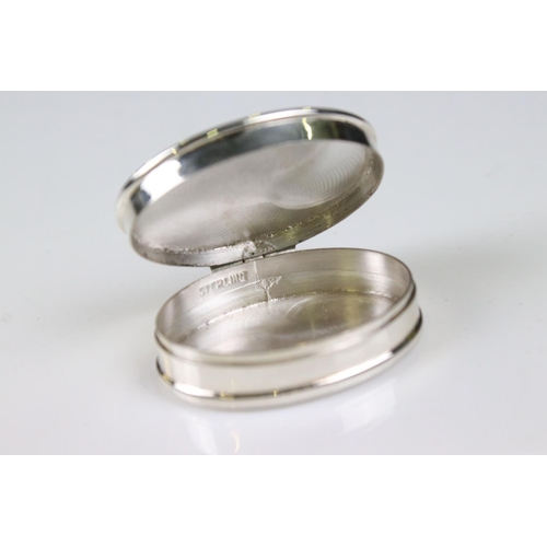 196 - Silver oval shaped pillbox with semi-nude enamel panel