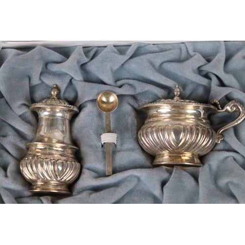 208 - A cased sterling silver cruet set together with a silver plated tray and dish.