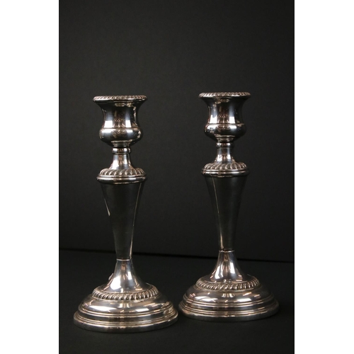 213 - Pair of Silver Plated Candlesticks in the Georgian manner, 22cm high