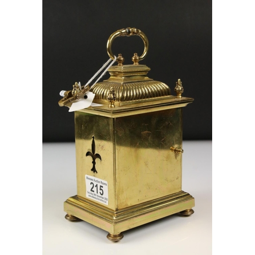 215 - An antique brass cased carriage clock with Fluer De Lis decoration, marked for Lund & Blockley of Lo... 