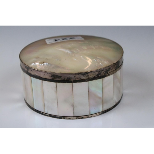 224 - A mother of pearl powder jar with white metal banding together with a similar lipstick holder.