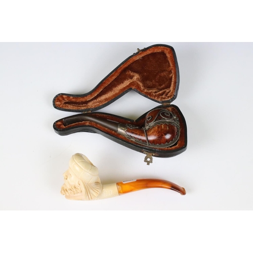 226 - Two meerschaum pipes, one cased with ornate silver decoration, lion's head front in lined case, the ... 