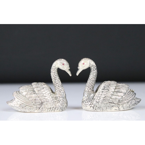 230 - Pair of silver plated condiments in the form of swans with ruby eyes