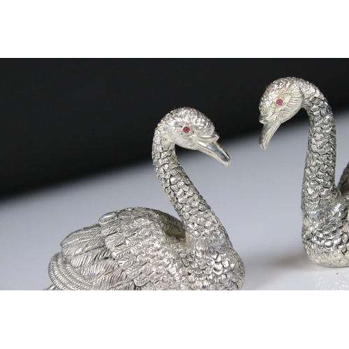 230 - Pair of silver plated condiments in the form of swans with ruby eyes