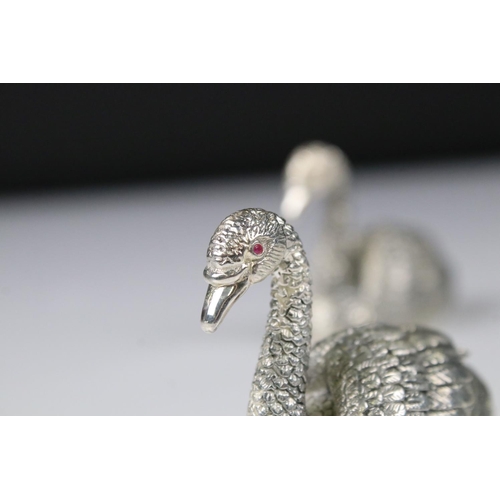 230 - Pair of silver plated condiments in the form of swans with ruby eyes