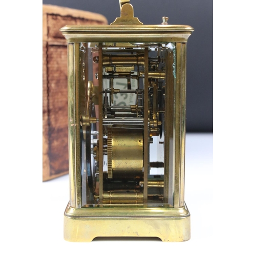 231 - A French made brass cased carriage clock with bevelled glass panels, repeater function button to top... 