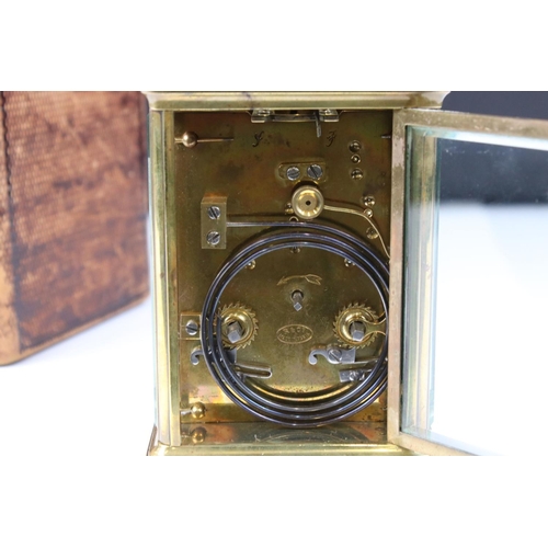 231 - A French made brass cased carriage clock with bevelled glass panels, repeater function button to top... 