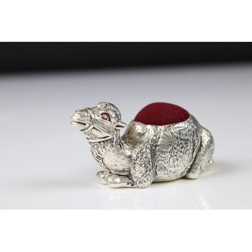 234 - Silver pincushion in the form of a camel with ruby eyes