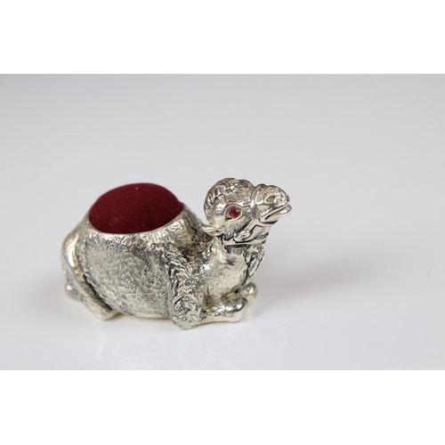 234 - Silver pincushion in the form of a camel with ruby eyes