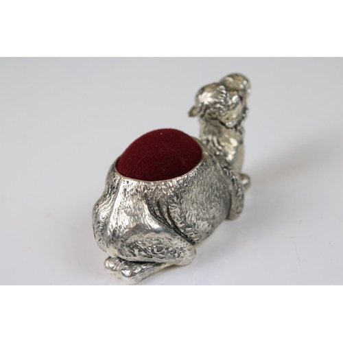 234 - Silver pincushion in the form of a camel with ruby eyes