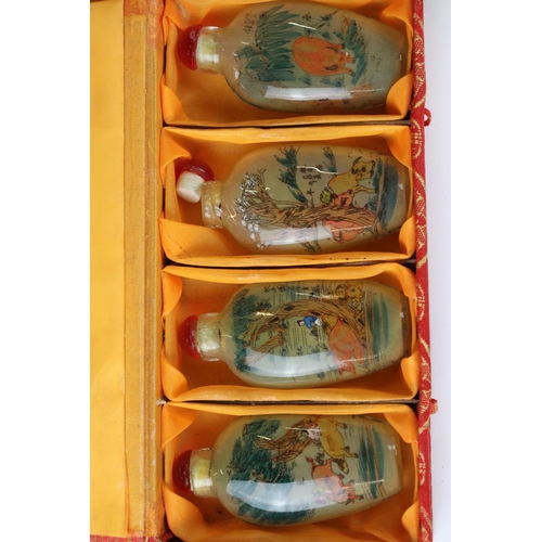 235 - A cased set of four Chinese reverse painted glass snuff bottles together with a pair of cased Chines... 